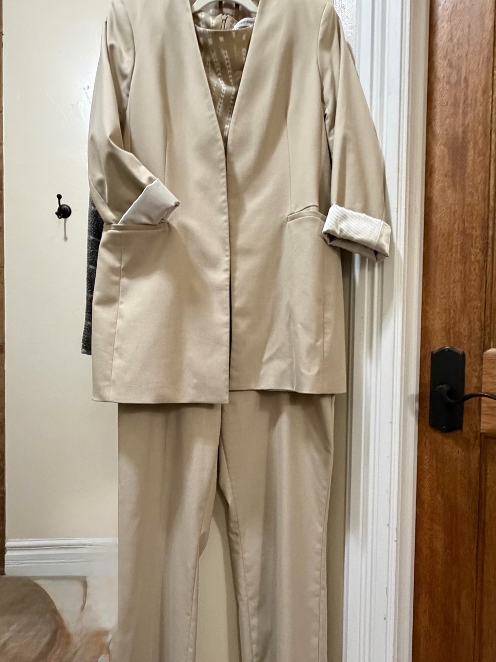 Calvin Klein Beige Open-Front Longline Blazer with matching slacks and blouse.
